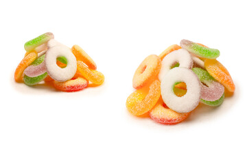 Assorted gummy candies isolated on a white background. Top view.