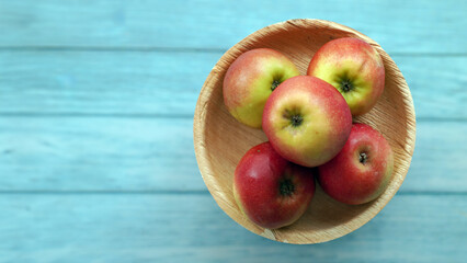 Naklejka na ściany i meble Close-up of Fresh Organic Red Apples on Wooden Surface
