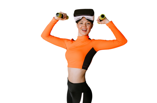Cheerful hispanic young woman in sportswear and virtual reality headset on forehead bends hands holds dumbbells looks at camera toothy smiles against transparent background. Sport