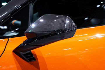 Car side mirror coated with Kevlar
