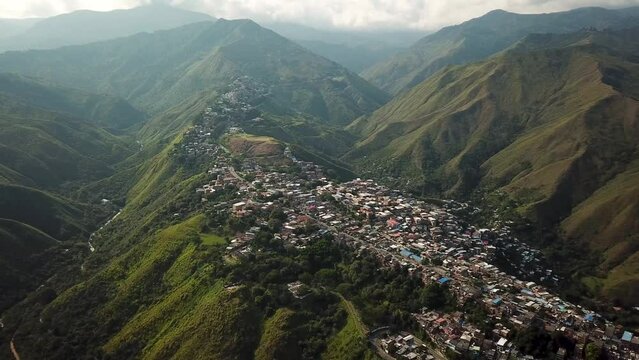 Aerial drone footage of Cali, Colombia, South America. Drone shot of favela in the hills near Cali, Latin America. High quality 4k footage.