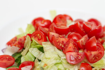 Vegetable salad macro photography. tomatoes, lettuce, greens and cucumbers