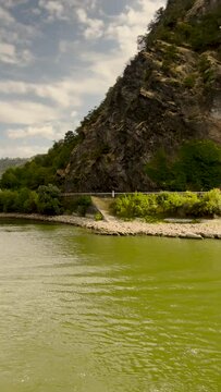 Traveling along the Rhine River with scenic views of the medieval landscape of St. Goarshausen, Germany and the Loreley slate rock. Located Rhine Gorge (Middle Rhine).