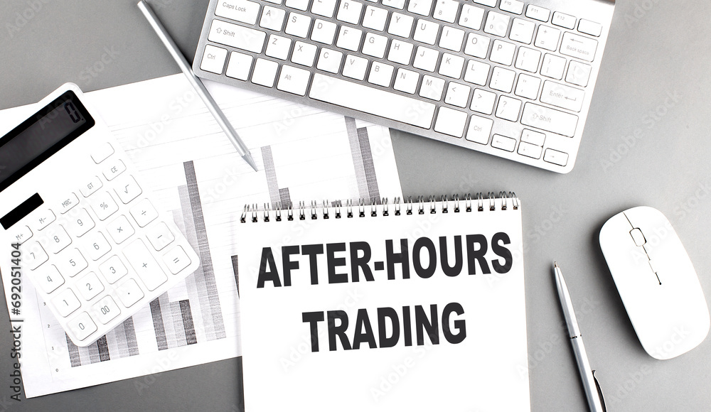 Poster after-hours trading text on a notebook with clipboard on grey background