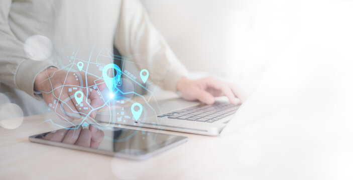 businessman using location application on maps on smartphone device online technology ,digital tablet computer, map and pin location with logistic global network travel for navigator to destinations