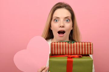 cute woman holding a gift box on valentine's day