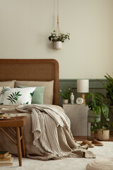 Bedroom interior with mock up poster frame, cozy bed, beige bedding, stylish lamp, plants in pots,...