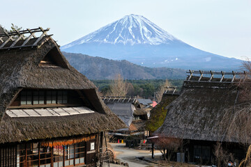 traditional houses in the village with mt fuji at the background