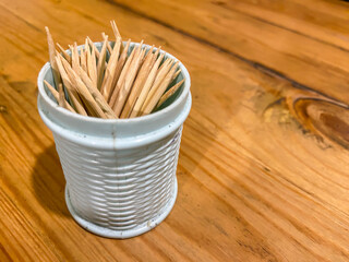 A toothpick is a small thin stick of wood, plastic, bamboo, metal, bone to remove detritus from...