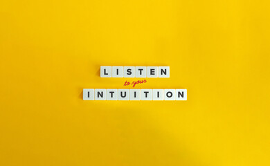 Listen to Your Intuition, Trust Your Gut Instinct, Listen to Your Inner Voice Concept. Block Letter Tiles and Cursive Text on Yellow Background. Minimalist Aesthetics. - obrazy, fototapety, plakaty