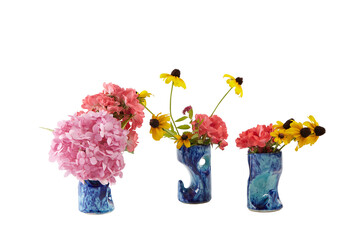 Lively flower bouquets in blue ceramic vases. Isolated no background png.