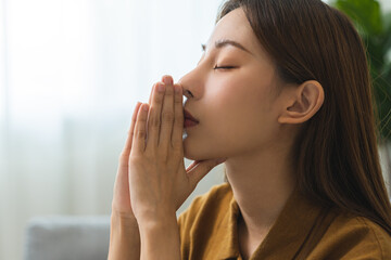 Believe faith charity, calm asian young woman show gratitude, folded hands in prayer feel grateful,...