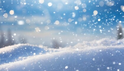 Winter snow background with snowdrifts, with beautiful light and snow flakes on the blue sky in the evening, banner format, copy space