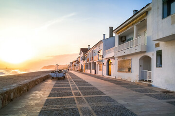  Sunset on the promenade  parallel to the Altafulla beach with its houses facing the Mediterranean Sea. Tarragon - obrazy, fototapety, plakaty