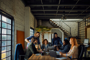 Business people having team meeting in modern office
