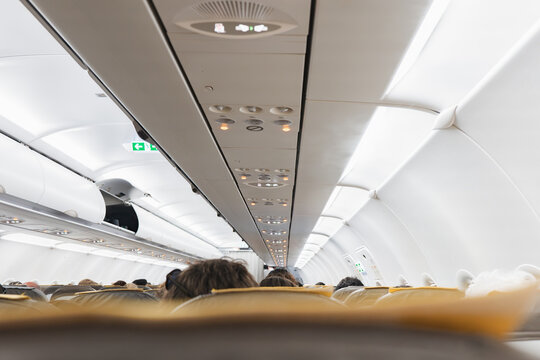 Airplane Cabin Interior View with Passengers