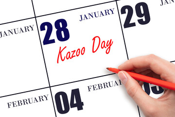 January 28. Hand writing text Kazoo Day on calendar date. Save the date.