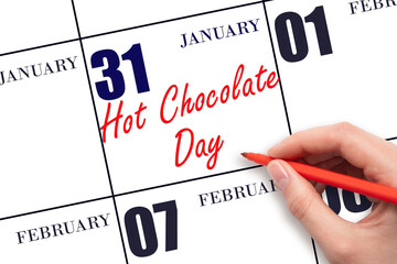 January 31. Hand writing text Hot Chocolate Day on calendar date. Save the date.