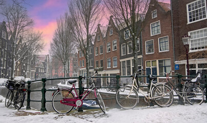 City scenic from snowy Amsterdam the Netherlands at sunset