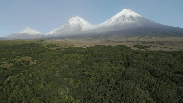 cinematic aerial video of of the natural volcanoes of Kamchatka UNESCO World Heritage Site. Klyuchevskaya Sopka drone video
