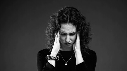 Dramatic Woman with Anxious Expression in black and white monochrome. Burnout emotion of 20s person...