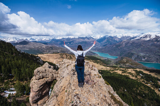 Hiker celebrating atop a ridge in Ordesa, Pyrenees