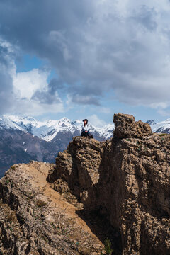 Adventurer woman standing atop a mountain in the Pyrenees