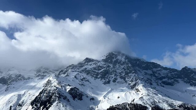 Panning shot of beautiful mountain range in winter