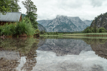 Fototapeta na wymiar Lake reflection photo at Almsee lake in Austria. 