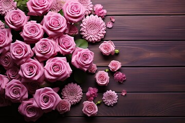 A collection of pink flowers arranged on a wooden table in Mother's Day  - Powered by Adobe
