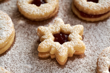 Homemade star shaped Linzer Christmas cookie on a table