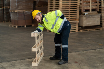 Caucasian businessman injured back pain in warehouse  