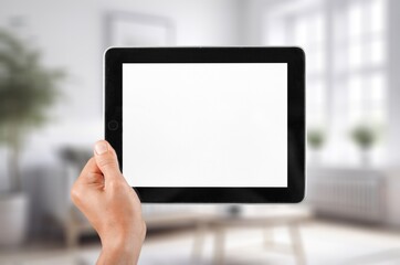 hands holding digital tablet with blank screen