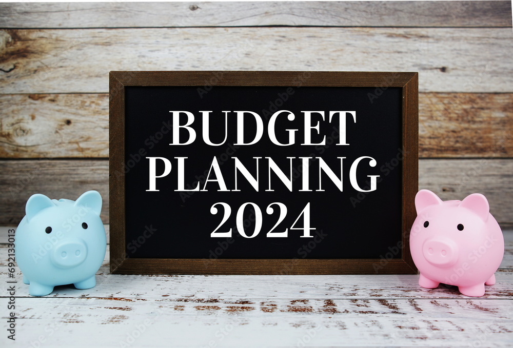 Poster budget planning 2024 typography text message with piggy saving on wooden background