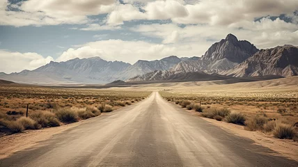 Foto op Plexiglas Dirt road with rocky mountains in background © Pedro Llinas