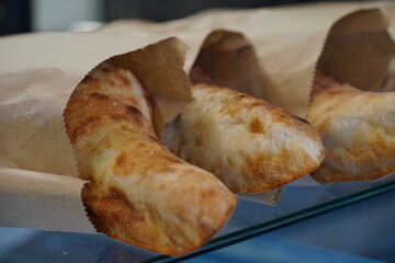 Hot Georgian bread in bags in the display case