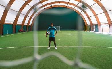Cinematic image of a soccer freestyle player making tricks with the ball.