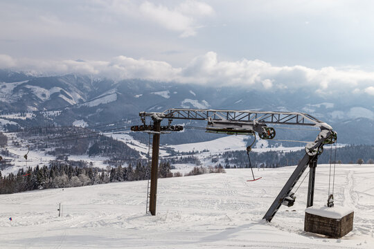 Rope tow, ski lift  at the top of snowy mountain. Zuberec Ski Park. Slovakia. Western Tatras. Skiing. Tourist destination, ski holidays