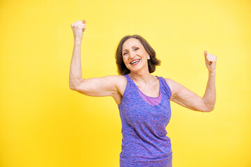 beautiful middle aged woman making sport at the gym