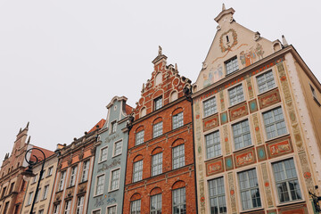 Fototapeta na wymiar Old historical colorful building architecture facade of Old Town in Gdansk. Traveling Europe in summer. Vacation concept
