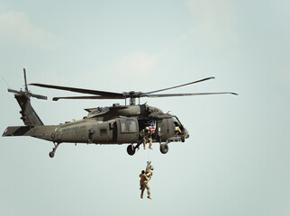 United States military helicopter. Combat US air force. Rescue mission exercise. - obrazy, fototapety, plakaty