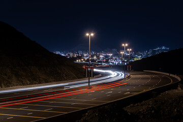 Mountain Glow: Khor Fakkan Highway Light Trails in the Dark