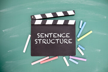 Sentence structure. Movie clapper and colored pieces of chalk - obrazy, fototapety, plakaty