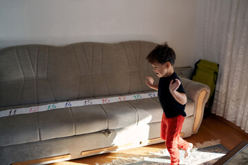 A boy with autism is flapping.