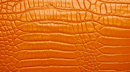 Zelfklevend Fotobehang Orange crocodile leather texture. © Hanna