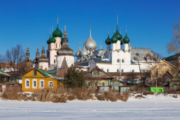 Fototapeta na wymiar Panorama of the Kremlin in Rostov the Great on a sunny winter's day, view from the lake Nero, Russia