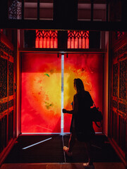 person in front of a wall