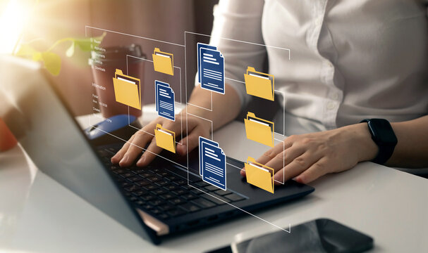 Online documentation database and document management system concept. Businesswoman working on laptop with virtual screen. Process automation to efficiently manage files.	
