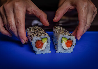 hand holding sushi