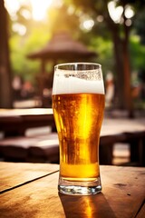  Glass of beer on a wooden table - 692186244
